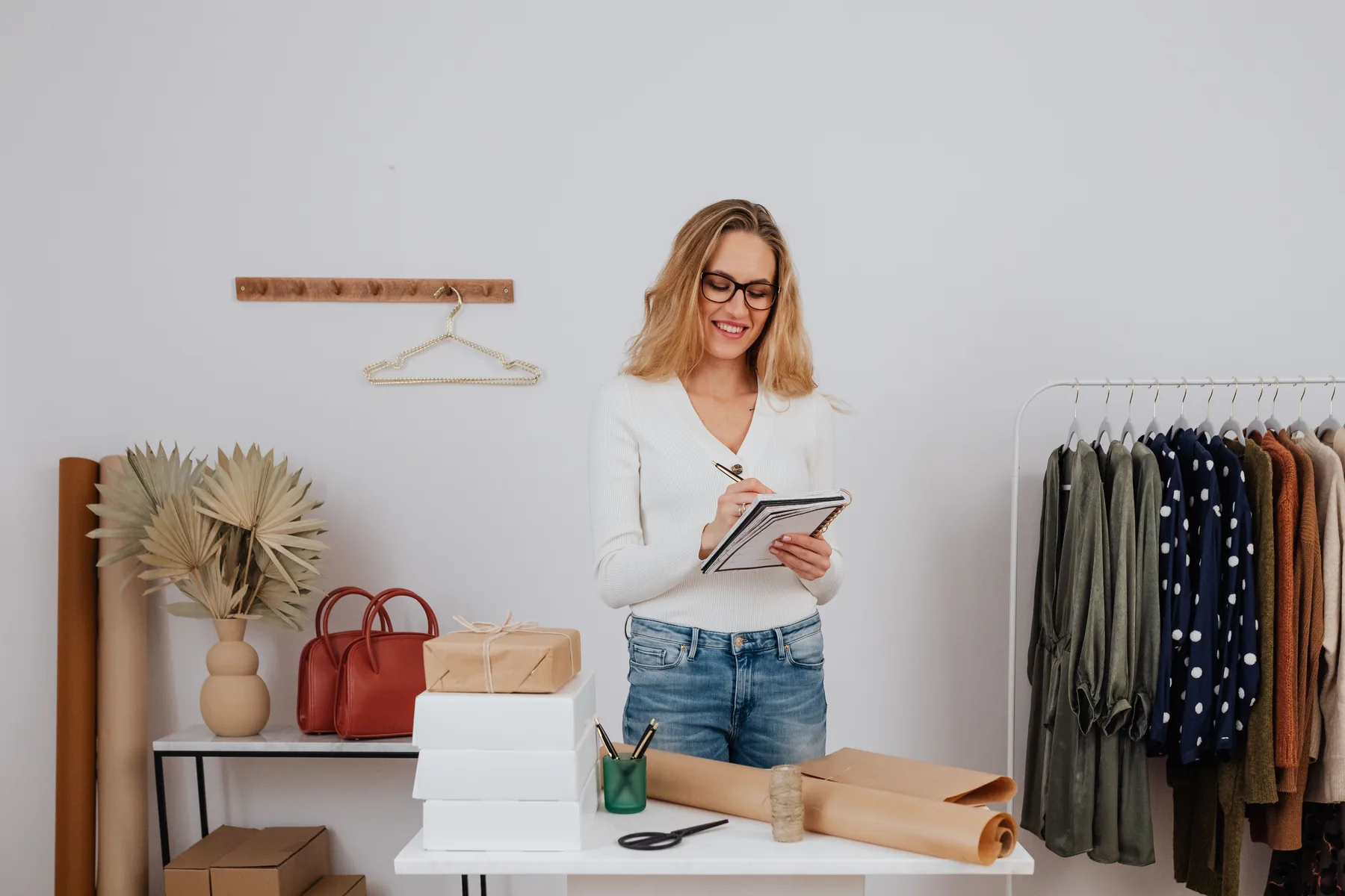 Small business owner planning and managing products